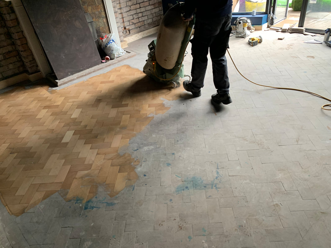lager floor sanding equipment being used with mirka dust extraction to finish a parquet floor in heswall