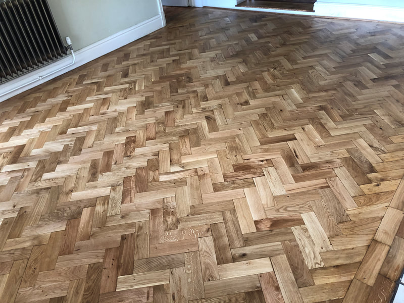 After photo of restored oak parquet flooring